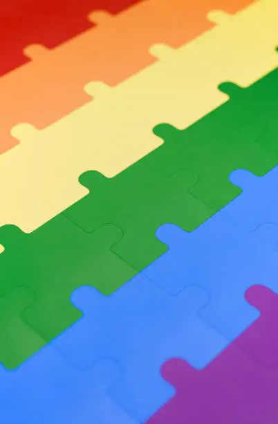 Photo of A jigsaw puzzle in pride flag colors