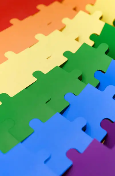 Photo of A jigsaw puzzle in pride flag colors