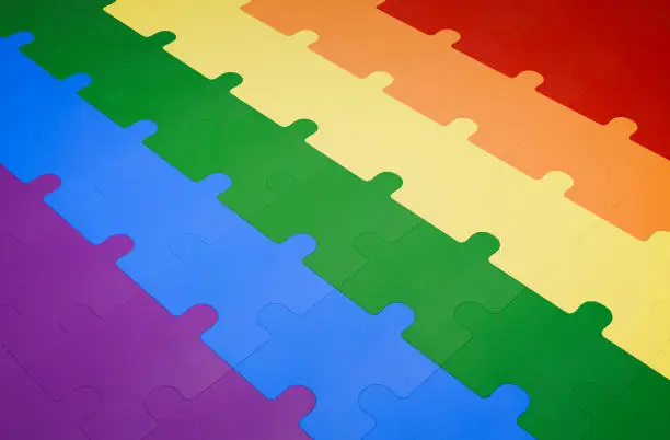 Photo of A jigsaw puzzle in rainbow pride flag colors