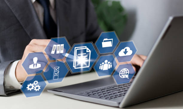 istock Concept of ERP and document management using icons on a virtual screen. 2099250576