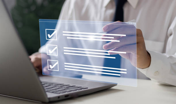 istock Businessman with smart checklist and signs electronic on digital documents concept, filling survey form online, answer questions of test. Education futuristic technology and learning concept. 2099253275