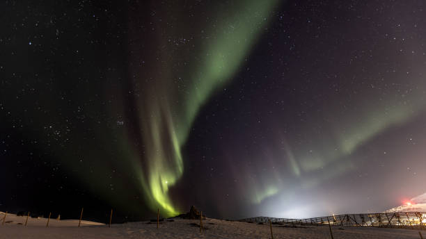 istock Northern lights with winter landscape. 2099266117