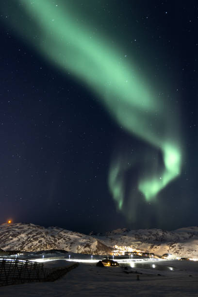 istock Northern lights with winter landscape. 2099267179
