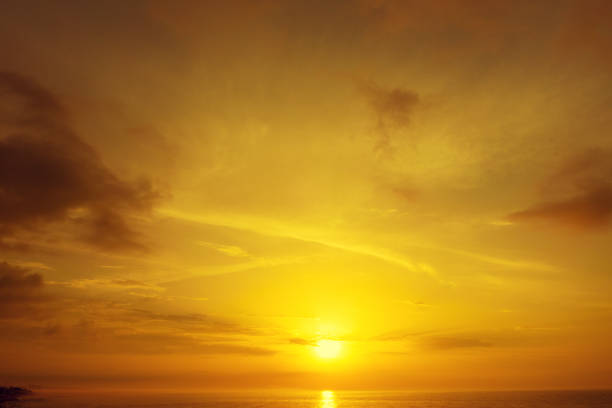 Golden cloudy sky at sunset. Sky texture. Abstract nature background