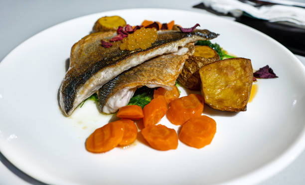 istock Seabass fillet with potatoes in a restaurant. 2099273721