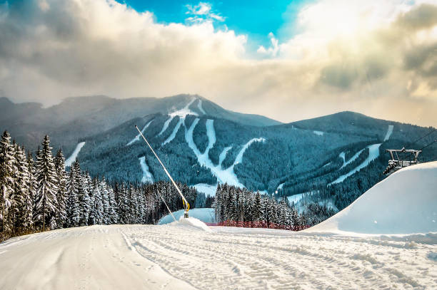 Ski slope on Carpathian ski resort in sunlight. Sport and recreation theme