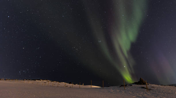 istock Northern lights with winter landscape. 2099274817