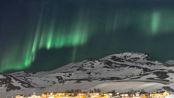 istock Northern lights with winter landscape. 2099277538