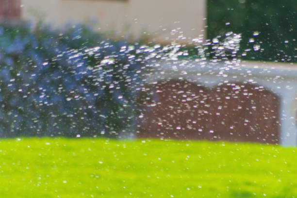 Blurry flying water droplets with multi-colored colored reflections and distortions at the edges. Refraction, decomposition of the optical spectrum of visible natural light.