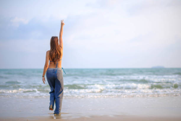 istock Beautiful Asian model, swimsuit and pose on the beach. 2099287311