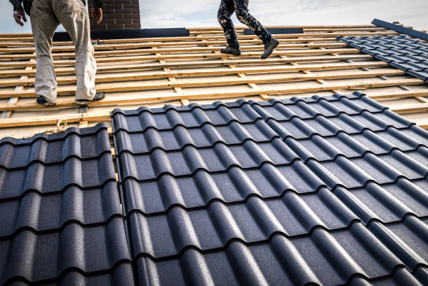 istock Professional masters (roofer) covers repairs metal roof tile 2099289547