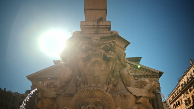 Close up view of the Fountain of the Pantheon in sunlight. Slow motion