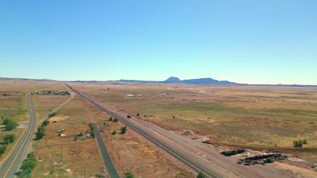Seligman Town Along The U.S. Route 66 On A Sunny Day In Arizona, USA. - aerial shot