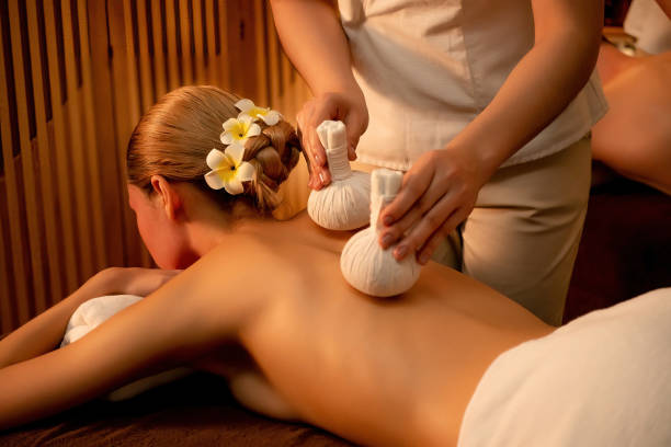 istock Hot herbal ball spa massage body treatment. Quiescent 2099298122