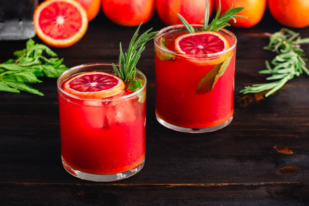 istock Sparkling Blood Orange Mocktails Garnished with Fresh Herbs 2099301784