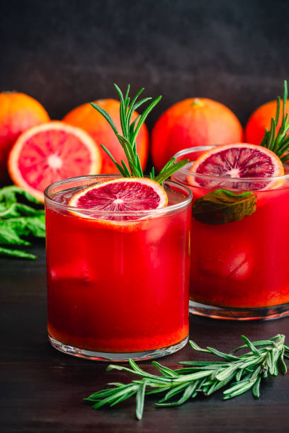 istock Sparkling Blood Orange Mocktails Garnished with Fresh Herbs 2099301791