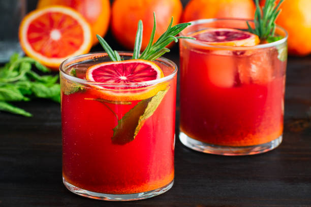 istock Sparkling Blood Orange Mocktails Garnished with Fresh Herbs 2099301798