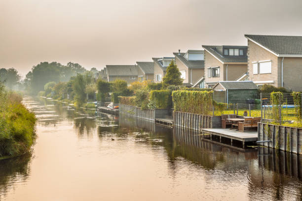 istock Homes on water edge in residential area 2099322943