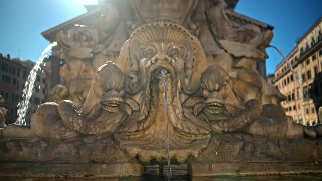 Close up view of the Fountain of the Pantheon in sunlight. Slow motion