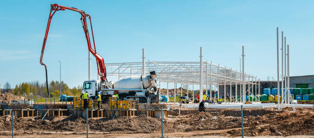 istock Urban area with machinery, car cement mixer,people are working on construction site.Panoramic view.Banner.Telsiai,Lithuania 05-10-2022. 2099338227