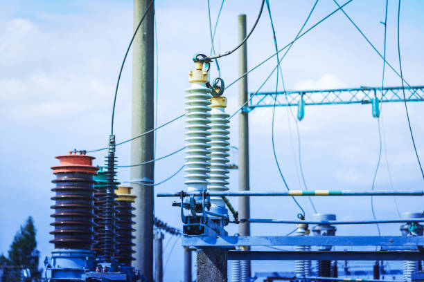 istock High voltage power transformer substation.High voltage electric power transformers in the blue cloudy sky.Toned. 2099350551