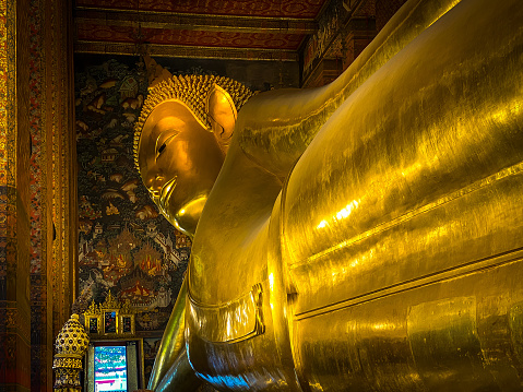 Wat Pho temple. Big Reclining golden Buddha statue (Phra Buddhasaiyas). Bangkok. Thailand.