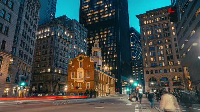 Time lapse of Crowd pedestrian and business tourist walking and crossing street intersections at Boston Old State House at night in Massachusetts, Boston, United States