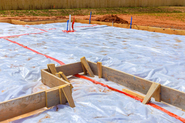 istock Ground is covered with waterproofing membrane before a foundation is poured 2099368900