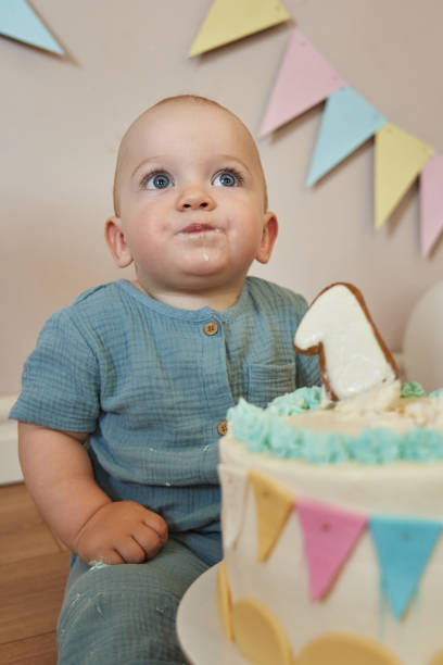 istock Marking his first year with a festive atmosphere and a delicious cake. 2099372676
