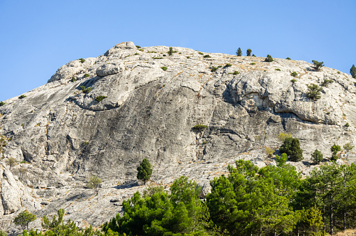 Mediterranean region, Taurus mountains. Forest rocks in the background, a steep mountain, clear sunny weather