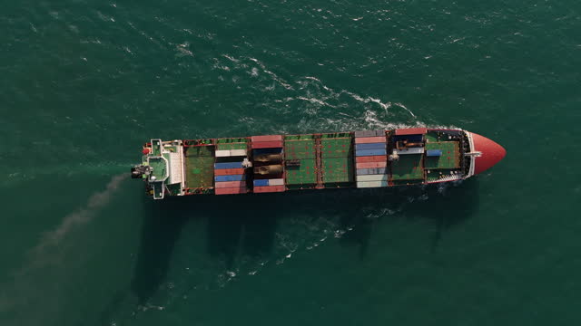 Aerial view from a container drone. Container ships in export-import and logistics business Transporting goods to large ports Worldwide shipping and logistics business International business abroad