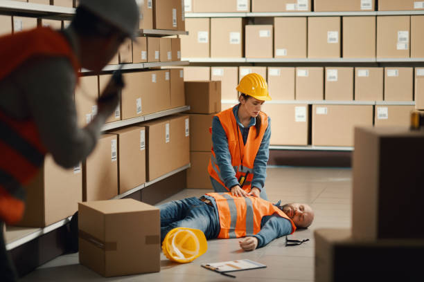 istock Unconscious injured worker lying on the floor 2099446738