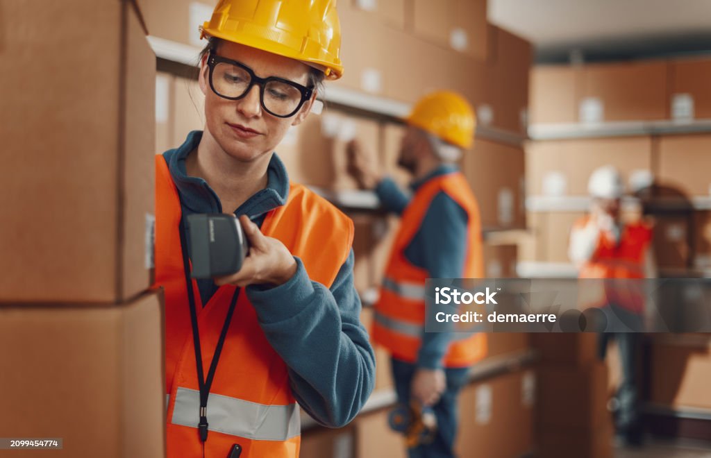 Warehouse Worker Scanning A Barcode On A Box Stock Photo - Download ...