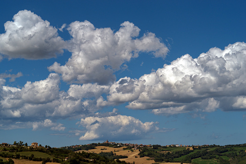 view of the hill against the majestic sky with clouds in Montefeltro