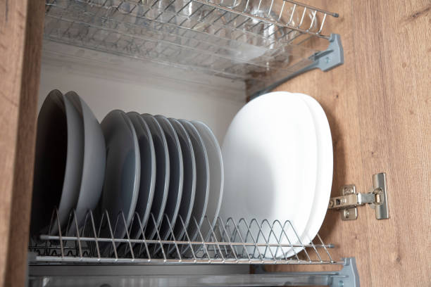 istock Set of different plates on the rack in the kitchen cabinet 2099513463