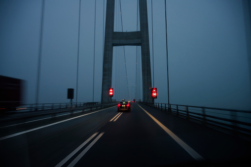 Great Belt Bridge in Denmark overcast day at dusk. Bridge between Zealand and Funen