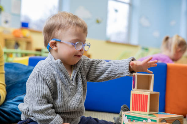 Child with Down Syndrome engaged in learning activities
