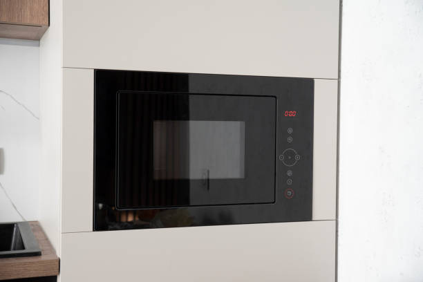 istock Black built-in microwave oven in kitchen furniture 2099528187