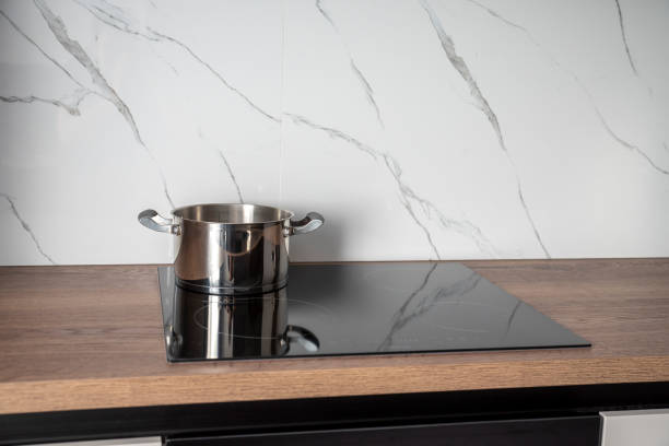 istock Stainless steel pot on induction hob 2099529469