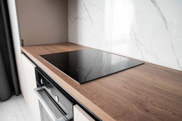 istock Modern black glass induction cooker on kitchen 2099529474