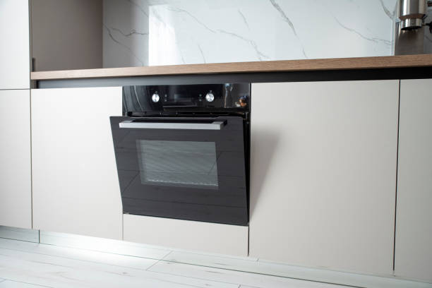 Black electric built-in oven in the kitchen wall