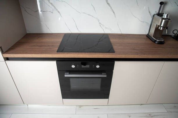 istock Built in electric oven and induction stove in a kitchen 2099531183