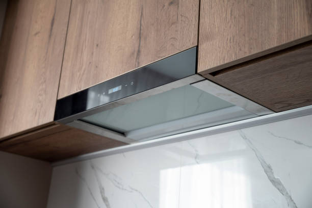 istock Built in kitchen range hood on a wooden kitchen 2099533271