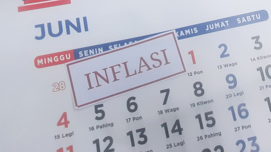 inflation label with june month calendar background