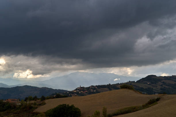 istock dark clouds in the sky on the profile of a hill 2099539741