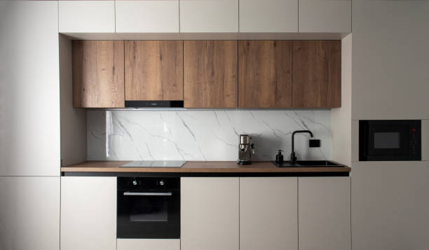 istock Modern built-in kitchen with appliances in a minimalist style 2099547239