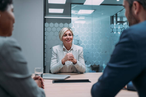 istock Group of business persons talking in the office. 2099549857