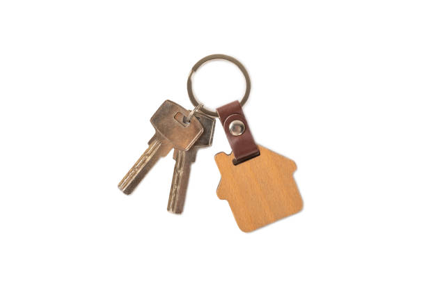 istock Plastic key ring in different colors with a place for a signature on a bright colored background. Bunch of keys with keychain. Mock-up keychain.Copy space.Concept for renting and selling real estate. 2099549861