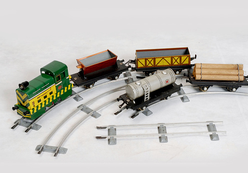 Close-up of the colorful kids toy town with a railroad. Wooden toys