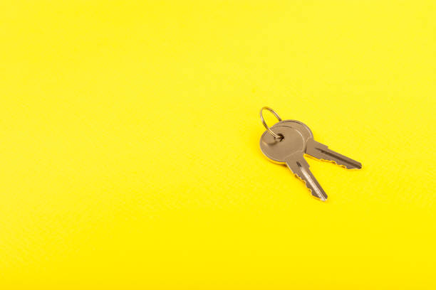 istock Plastic key ring in different colors with a place for a signature on a bright colored background. Bunch of keys with keychain. Mock-up keychain.Copy space.Concept for renting and selling real estate. 2099551962